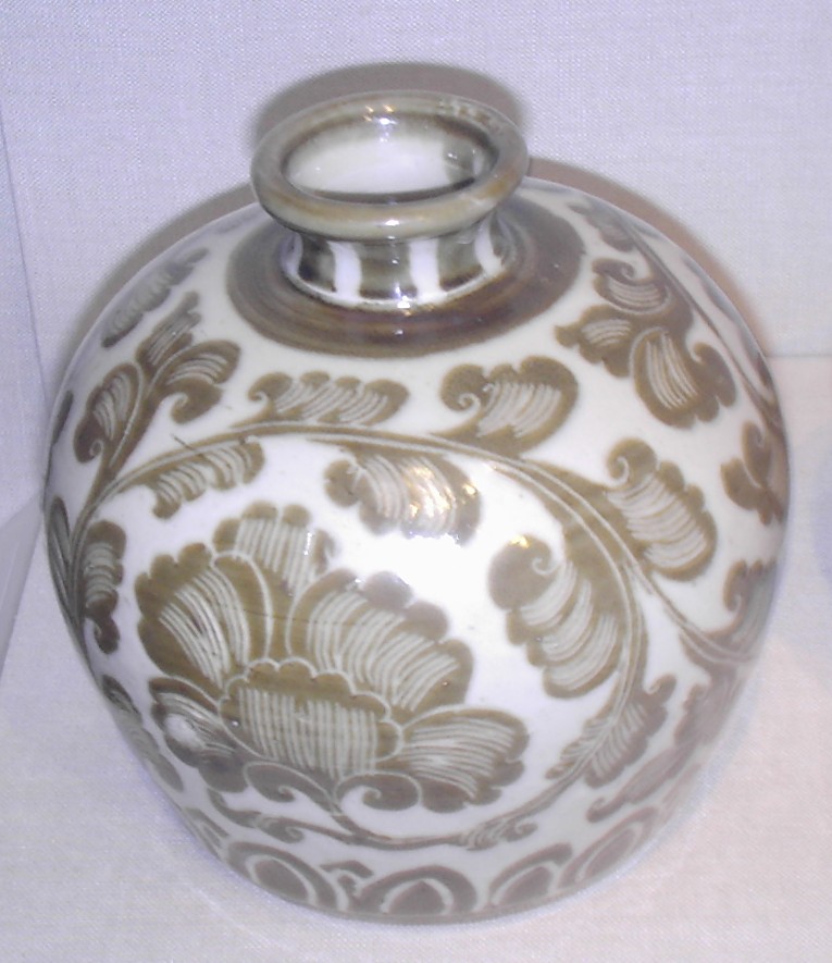 Song Dynasty ding-ware porcelain bottle with iron pigment under a transparent colorless glaze, 11th  ...