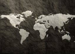 深灰色的墙壁上面画着世界地图墙壁上面的痕迹依稀可见背景花纹素材设计